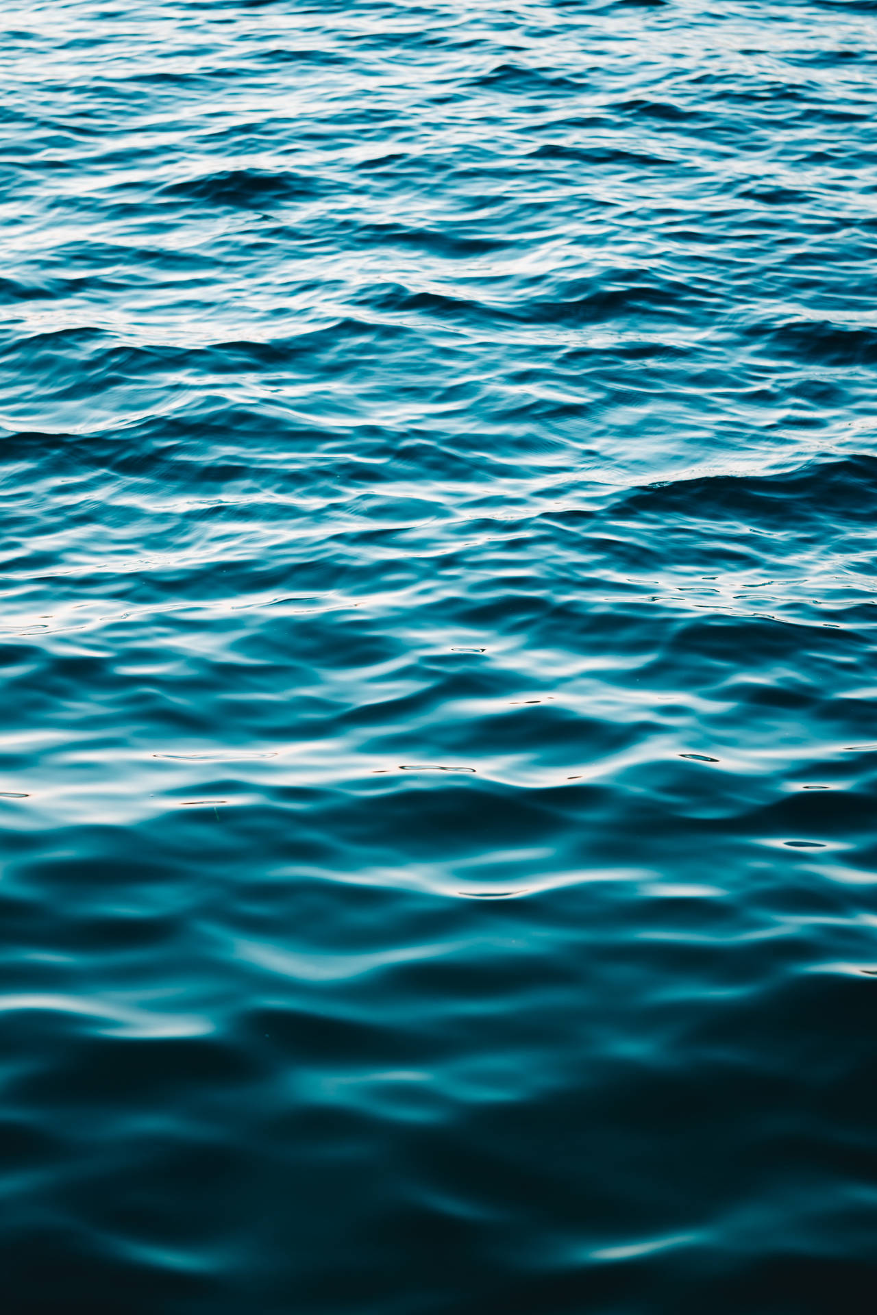 Solid Dark Blue Sea Water Surface Background