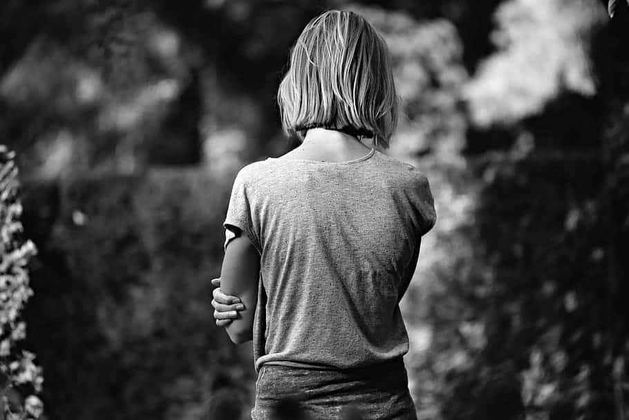 Solitary Girl Holding Herself Background