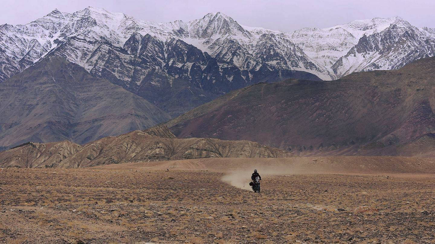 Solitary Himalayan Bike Rider Background