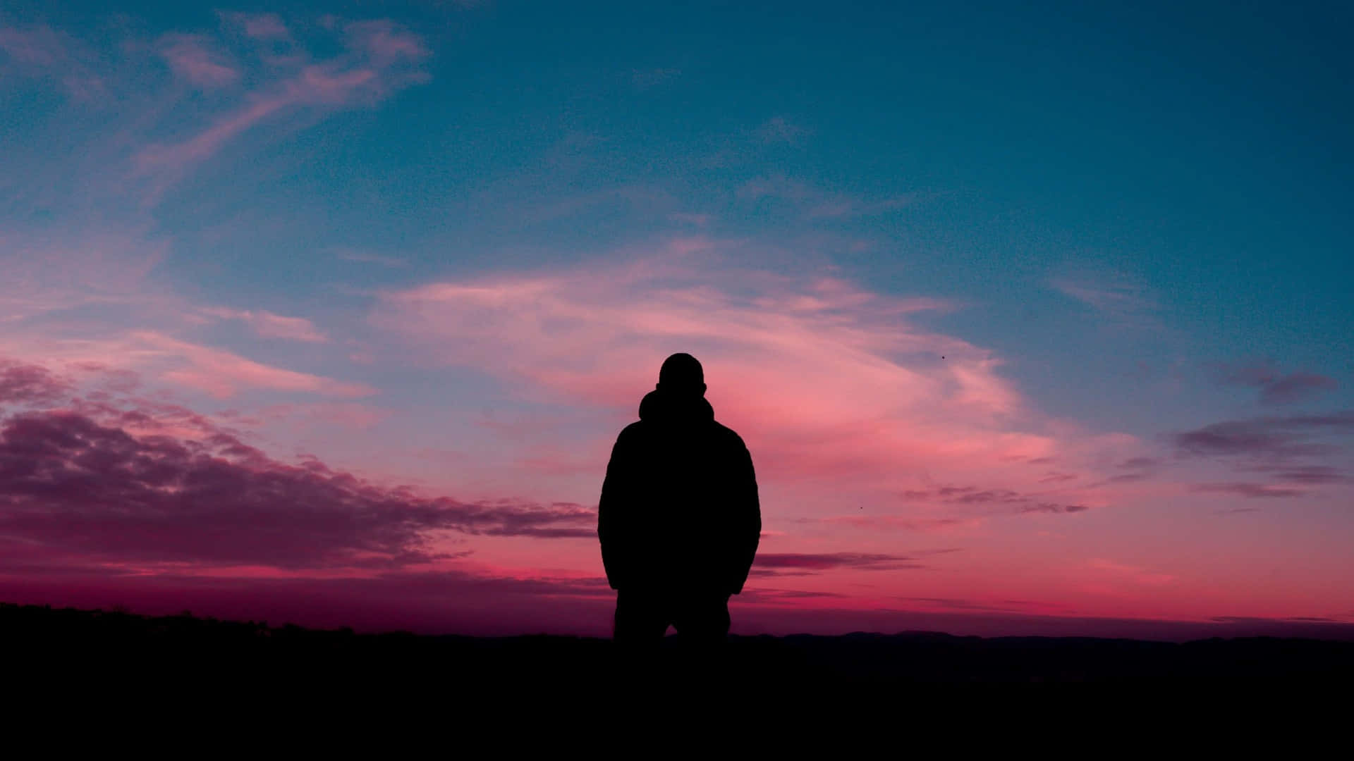 Solitary Man Orange Sky Background