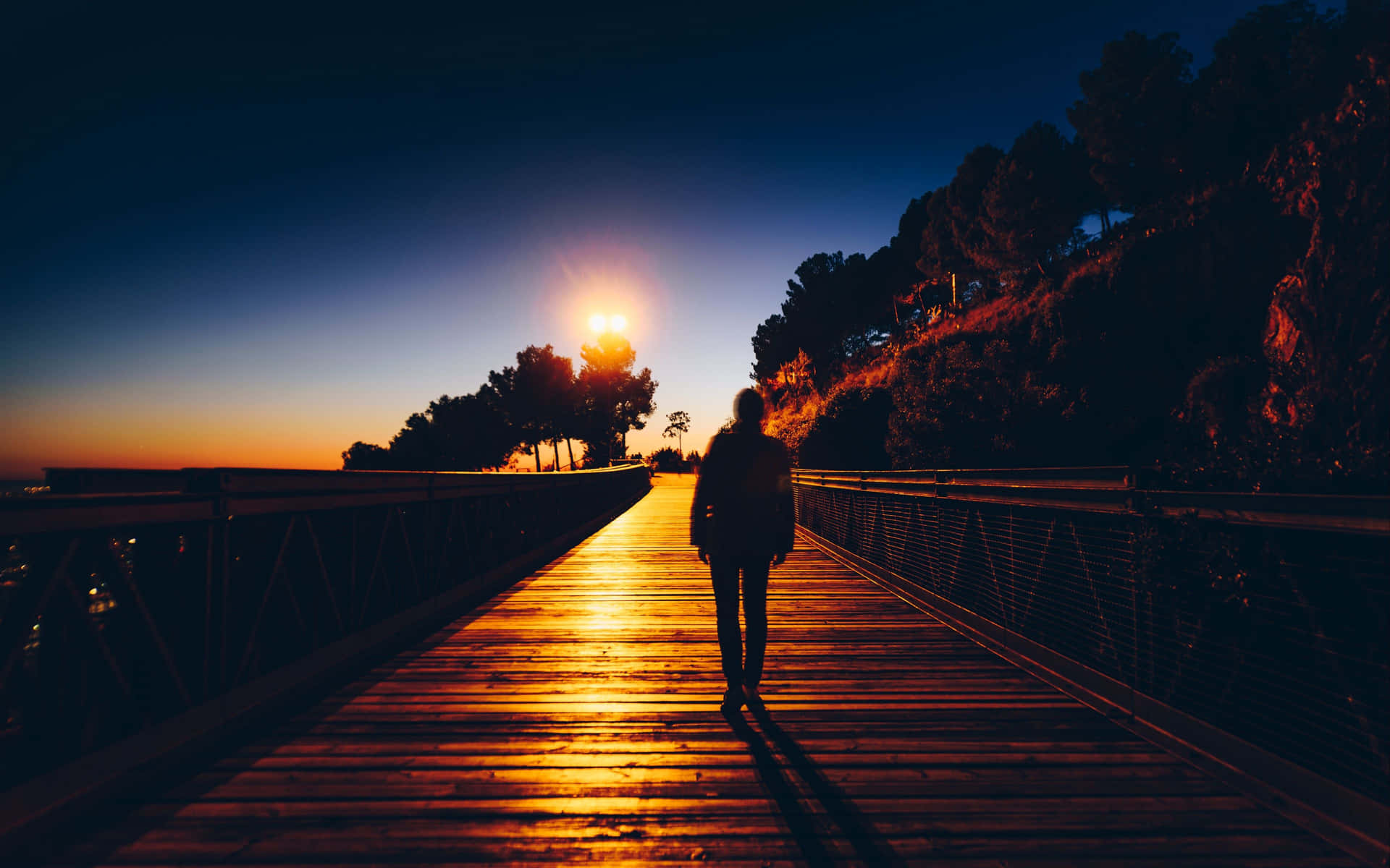 Solitary Man Walking In Sunrise Background