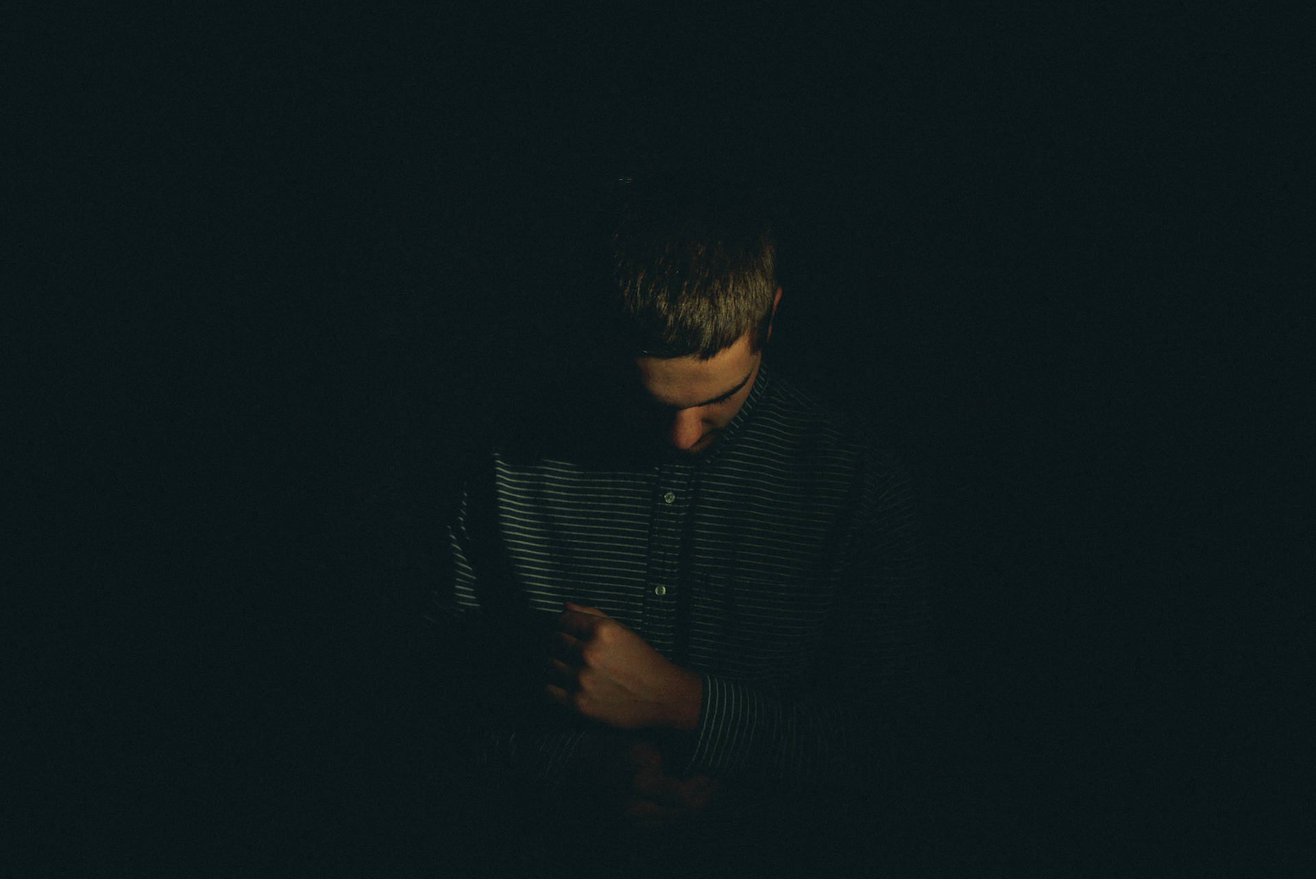 Solitude In Shadows - A Portrait Of A Sad Boy Background