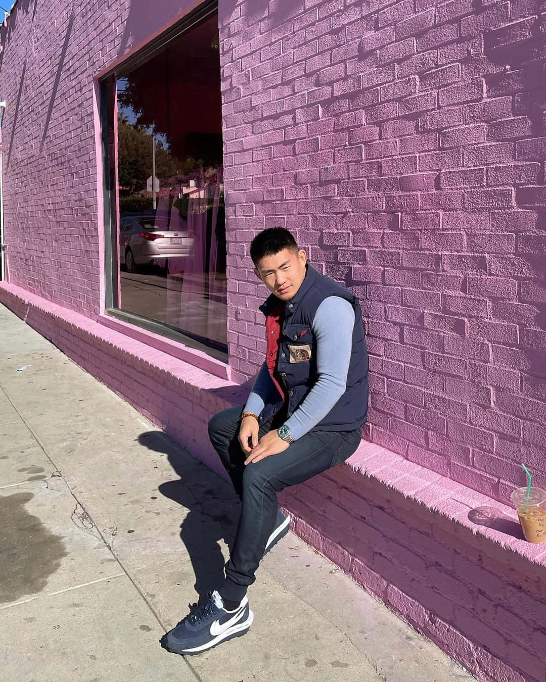 Song Yadong Sitting By Cute Purple Wall Background