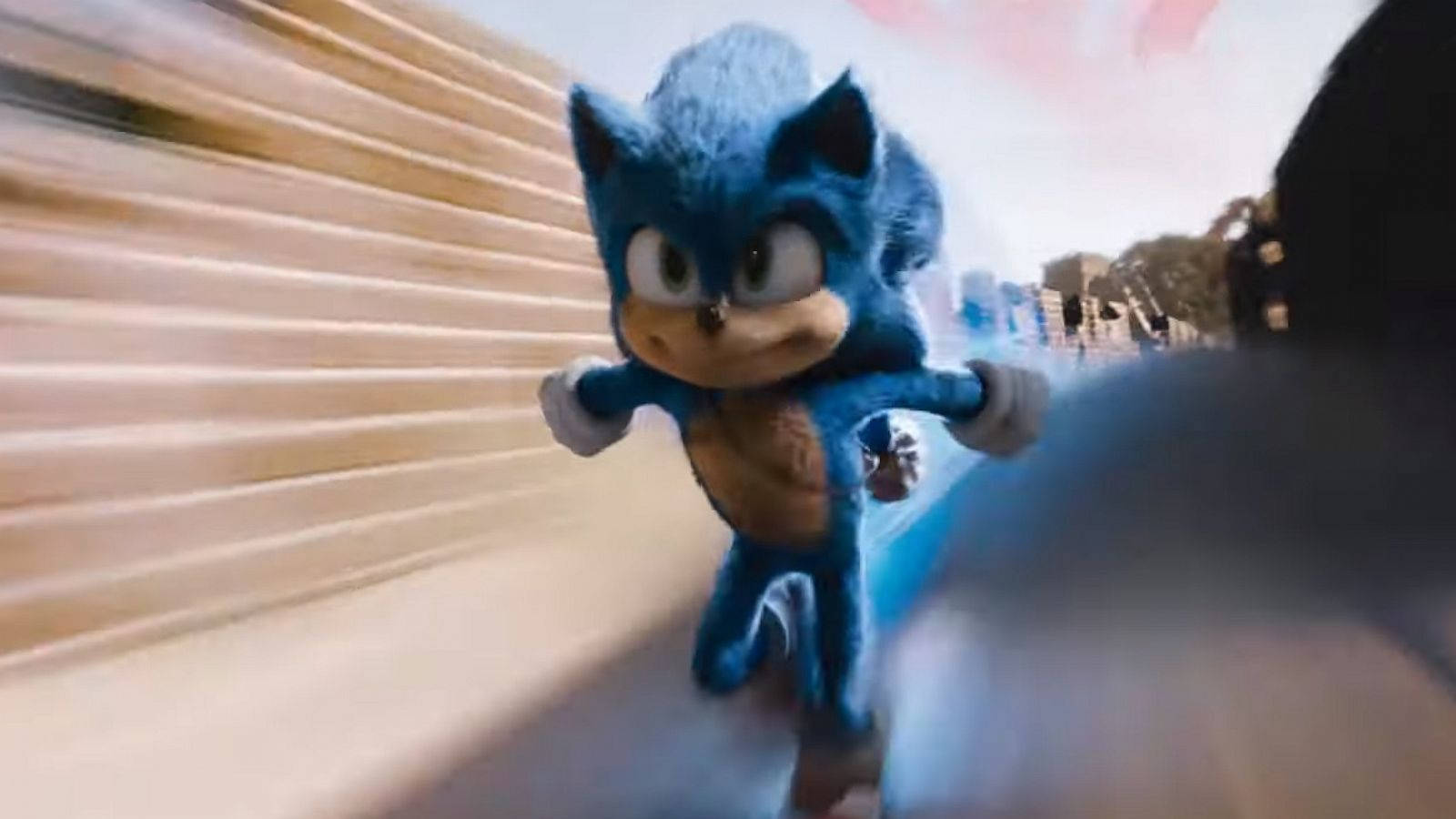 Sonic The Hedgehog Running Through A Street Background