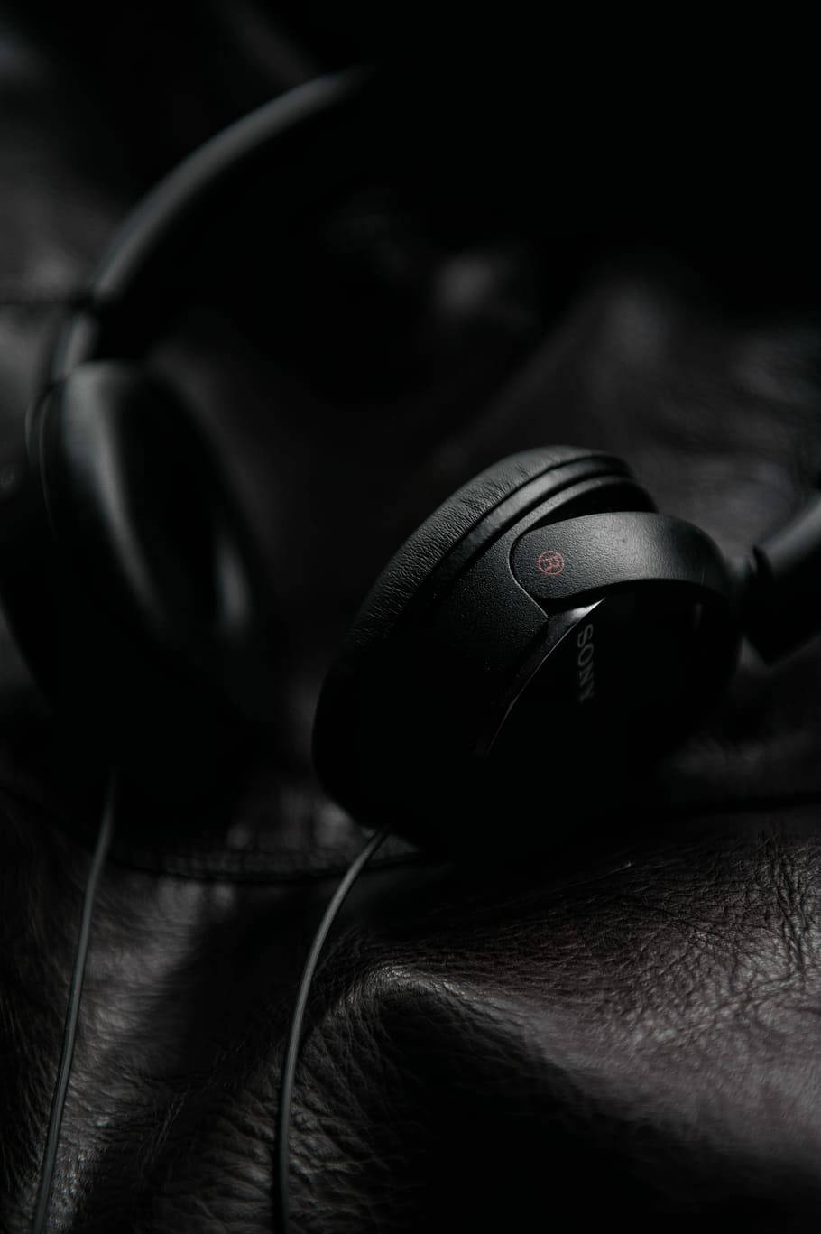 Sony Headphones On Black Leather Iphone Background