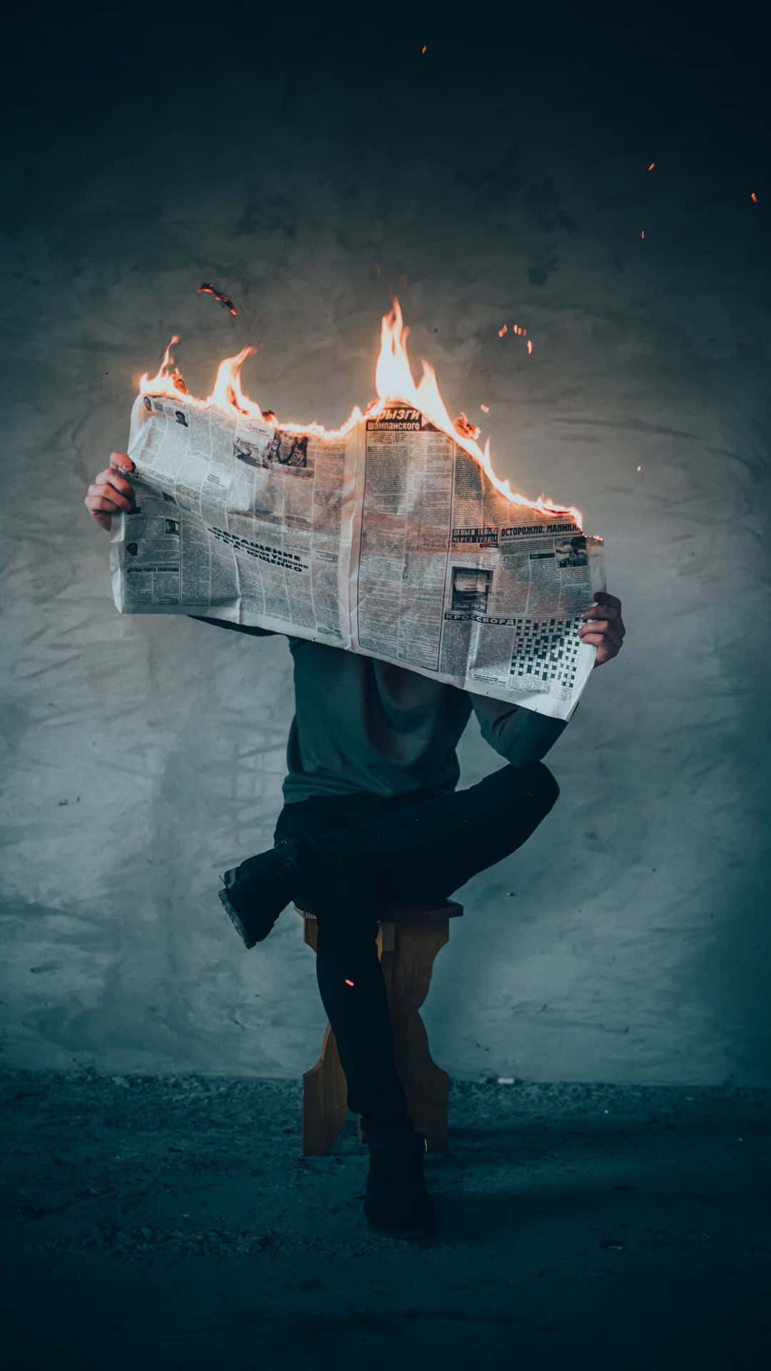 Sordid Story In A Flaming Newspaper Background