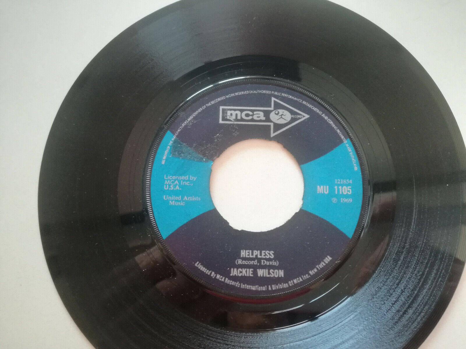 Soul Legend Jackie Wilson Holding A Vinyl Record Background