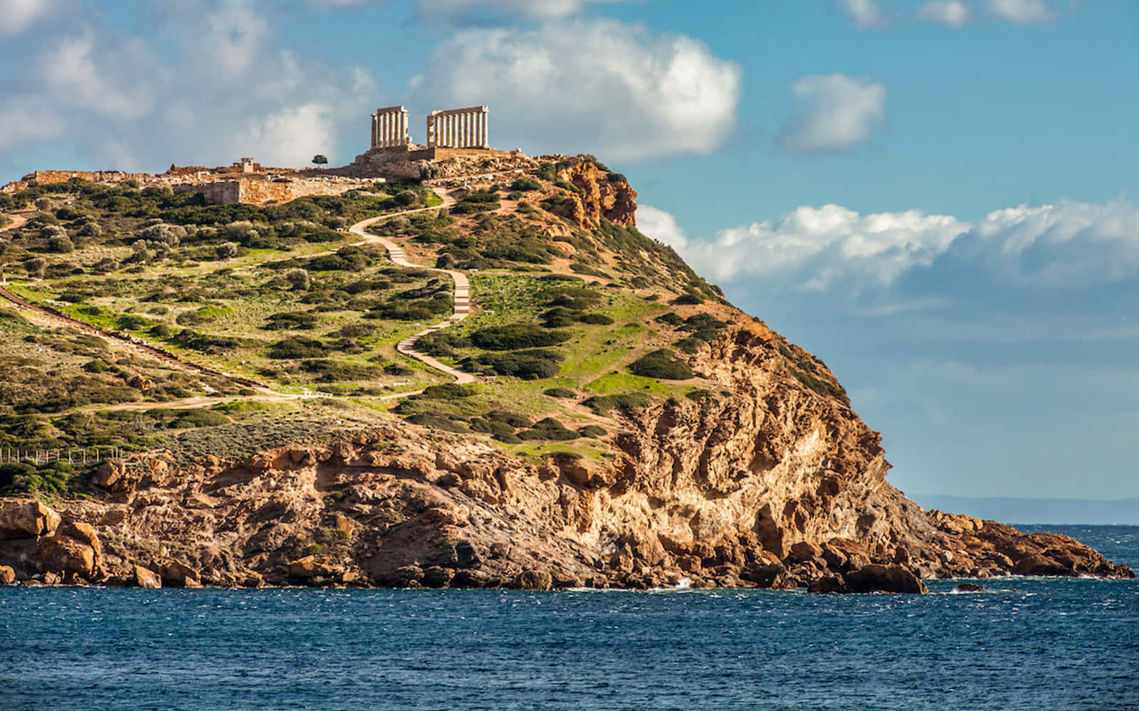 Sounion Between Ocean And Sky Background