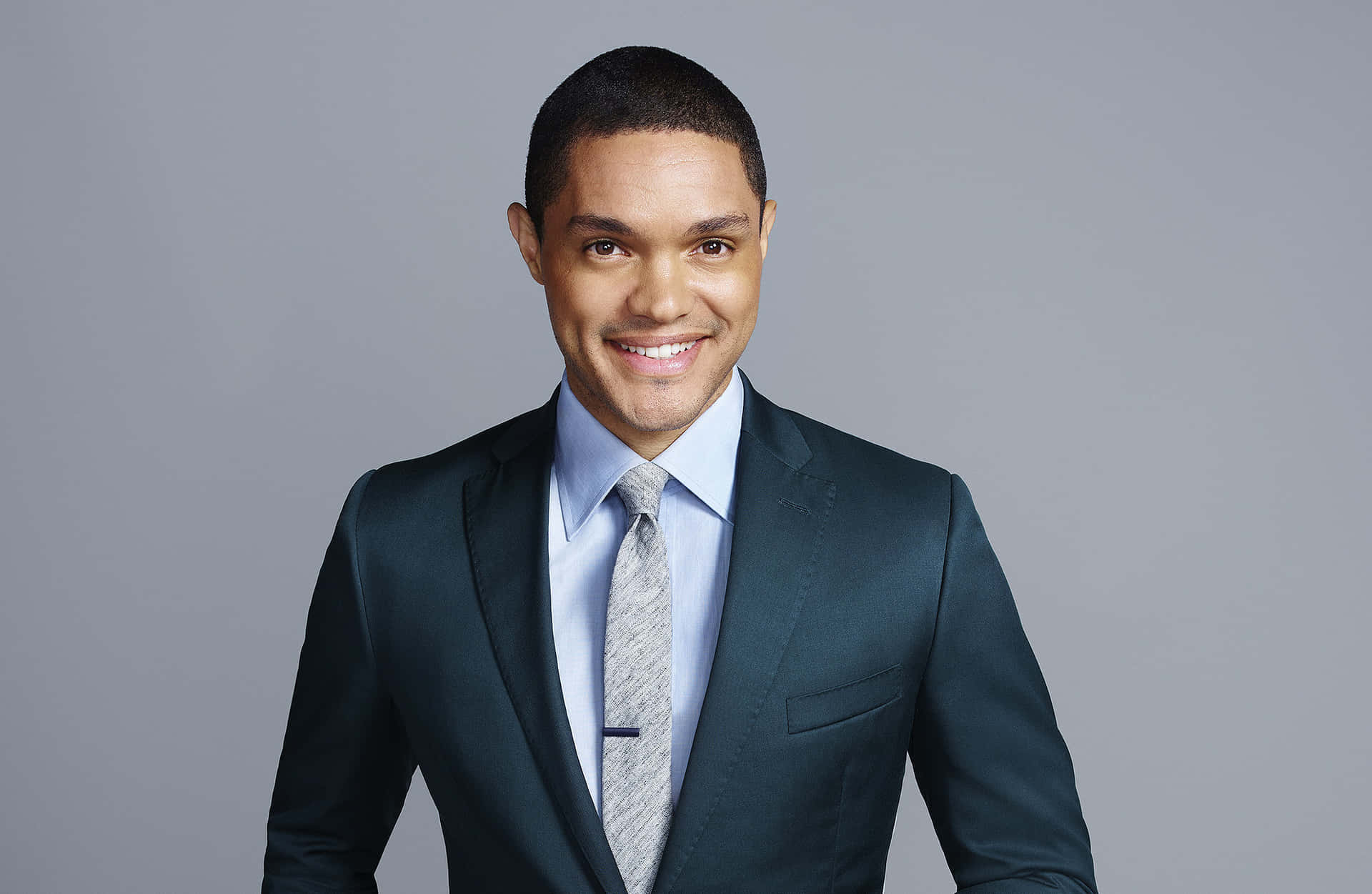 South African Comedian Trevor Noah In A Satin Men Suit Style Background