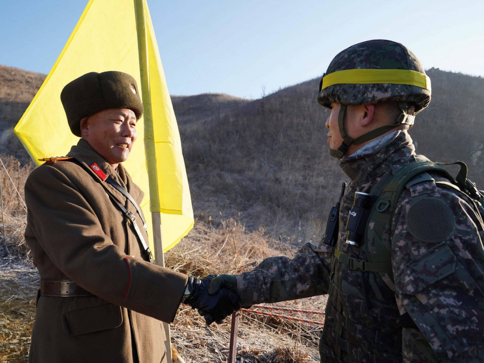 South And North Korea Soldiers Handshake Background