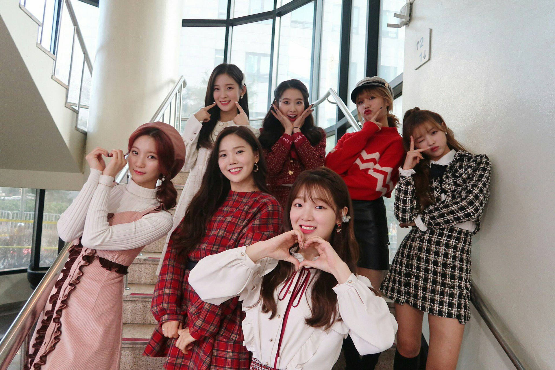South Korean Pop Sensation Oh My Girl In A Candid Group Photo Background