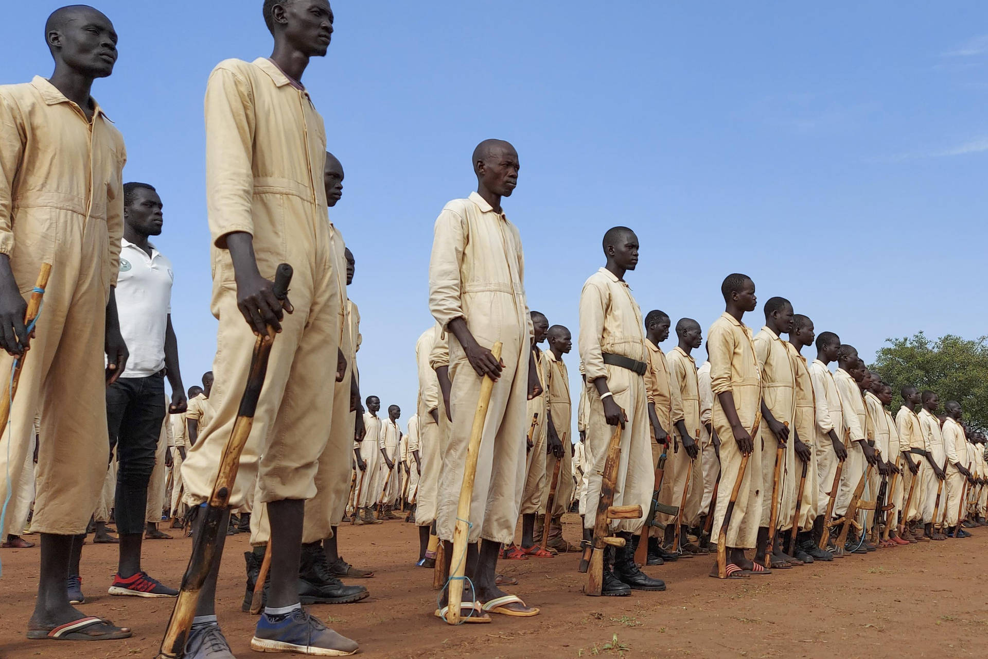 South Sudan Men Wooden Weapons Background