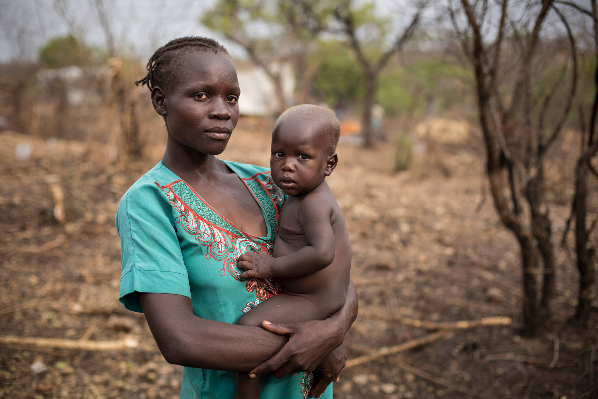 South Sudan Mother Holding Child Background