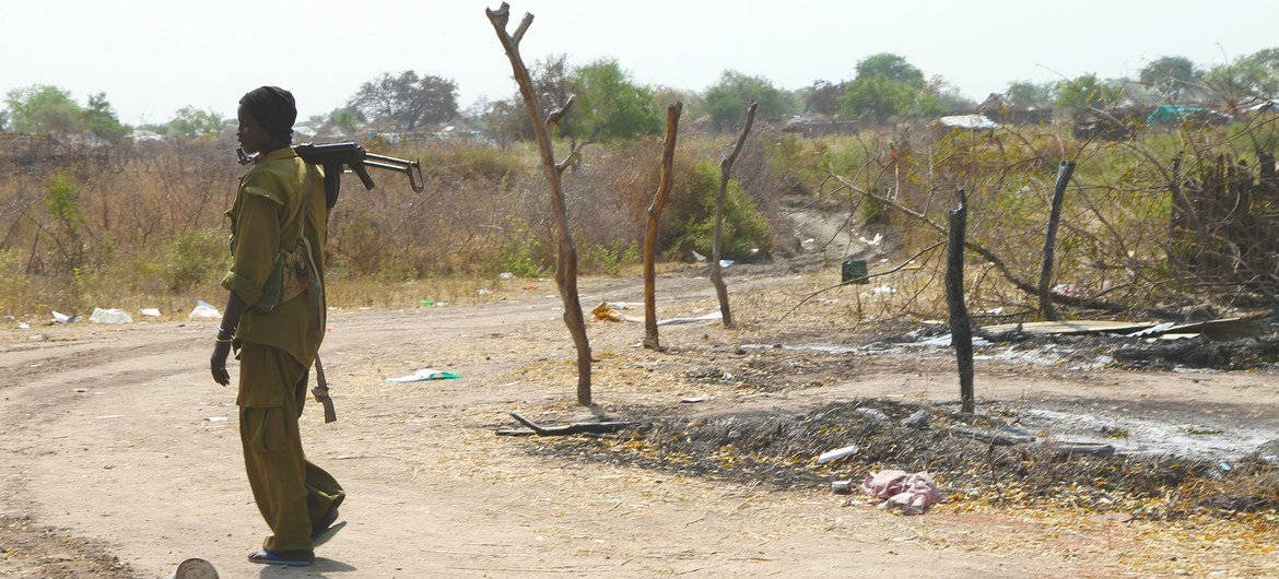 South Sudan Soldier Holds Gun Background