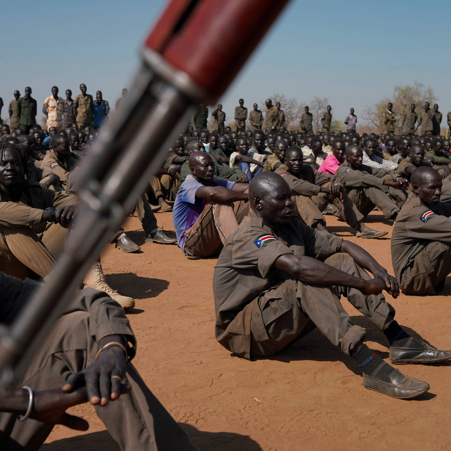 South Sudan Soldiers Sitting Ground Background