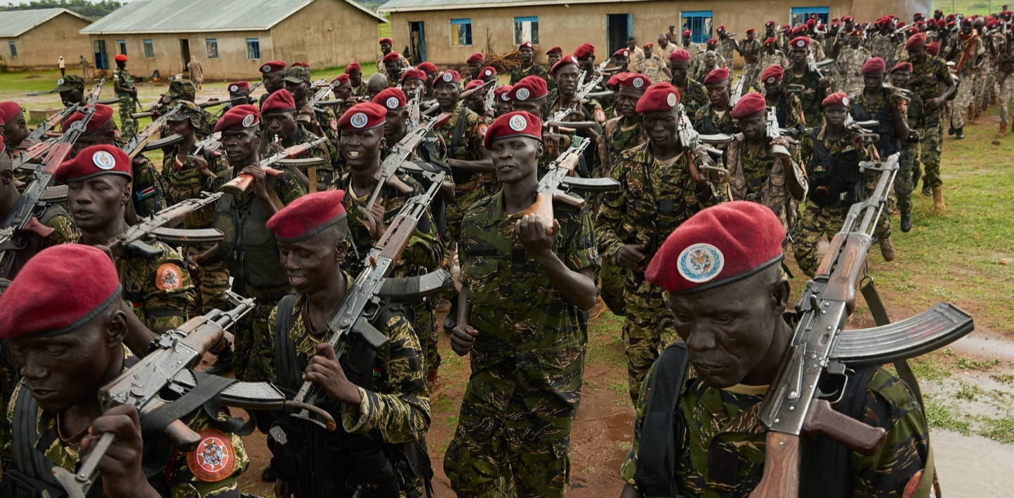 South Sudanese Soldiers In Red Berets Background