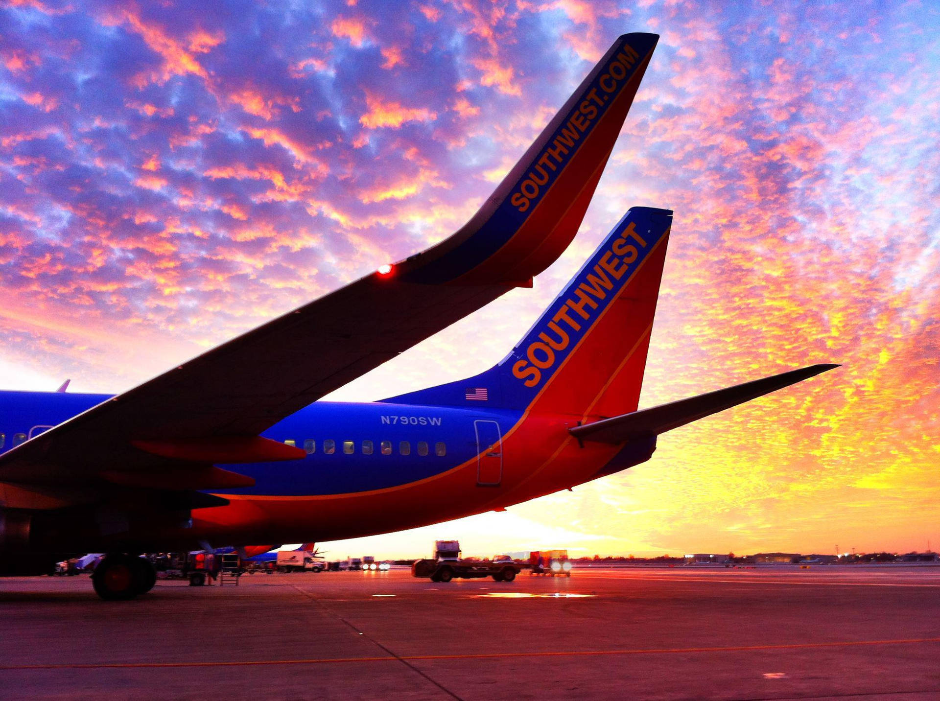 Southwest Airlines Airplane At Dusk Background