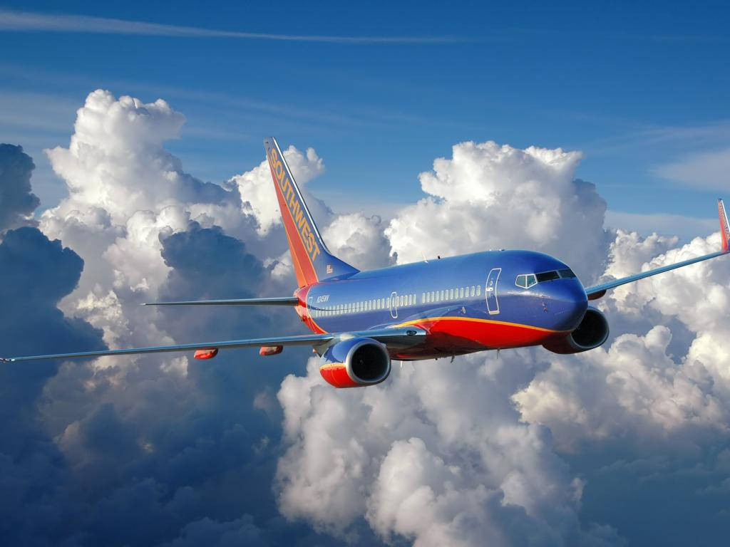 Southwest Airlines Airplane In Sea Of Clouds