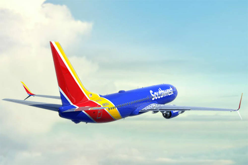 Southwest Airplane Flying On Radiant Skies