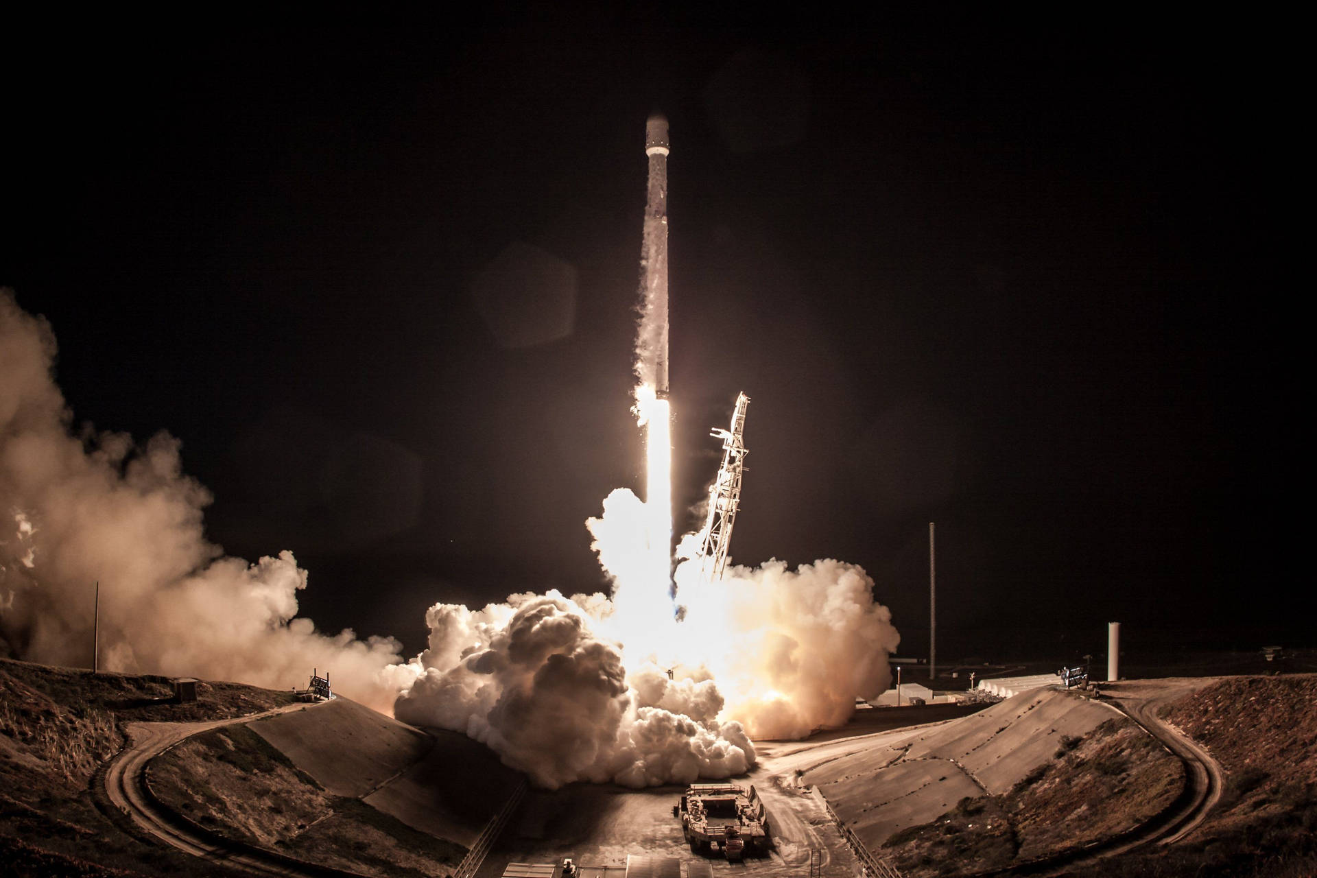 Spacex Launch Rocket At Night Background