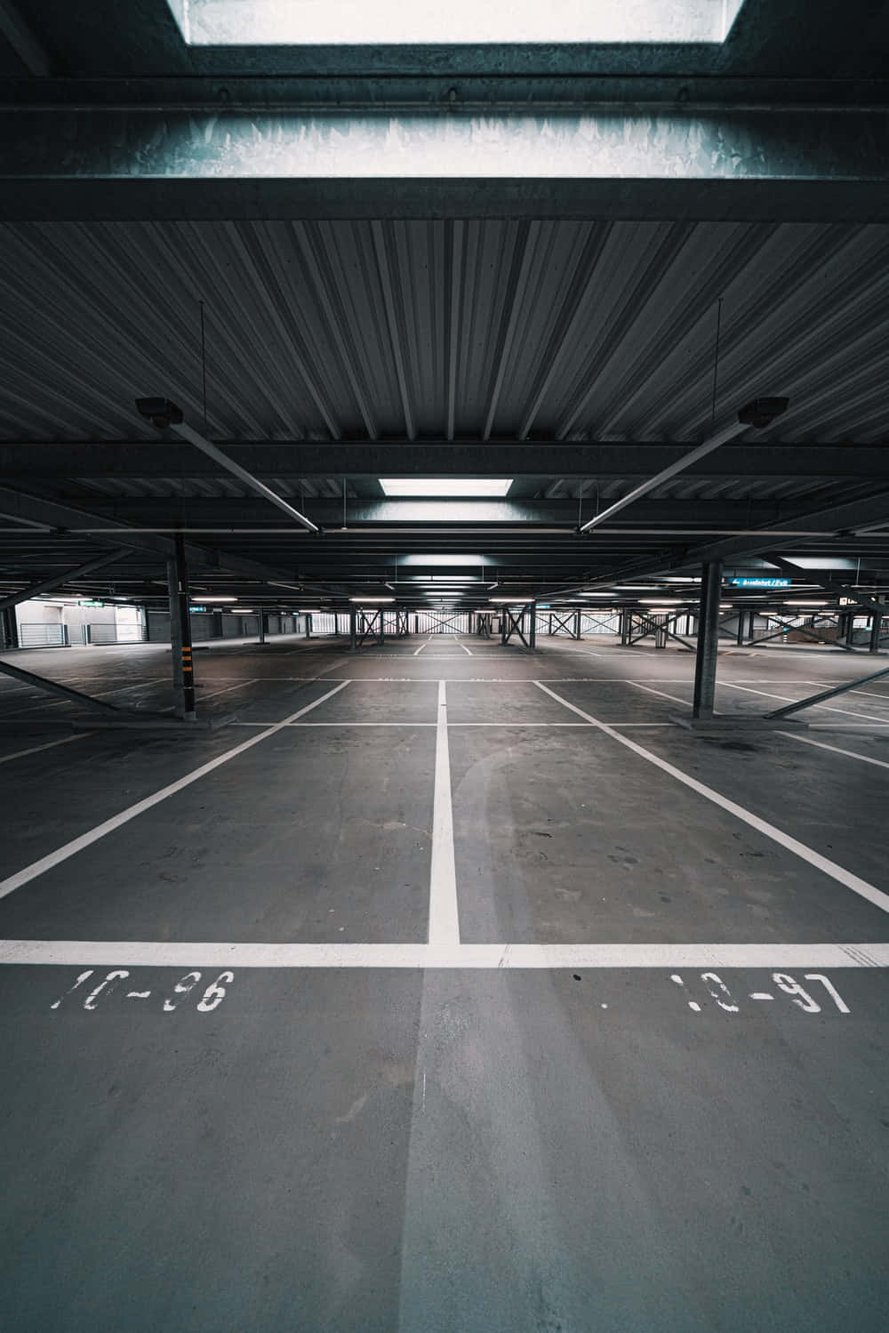 Spacious Underground Metal Parking Lot Background