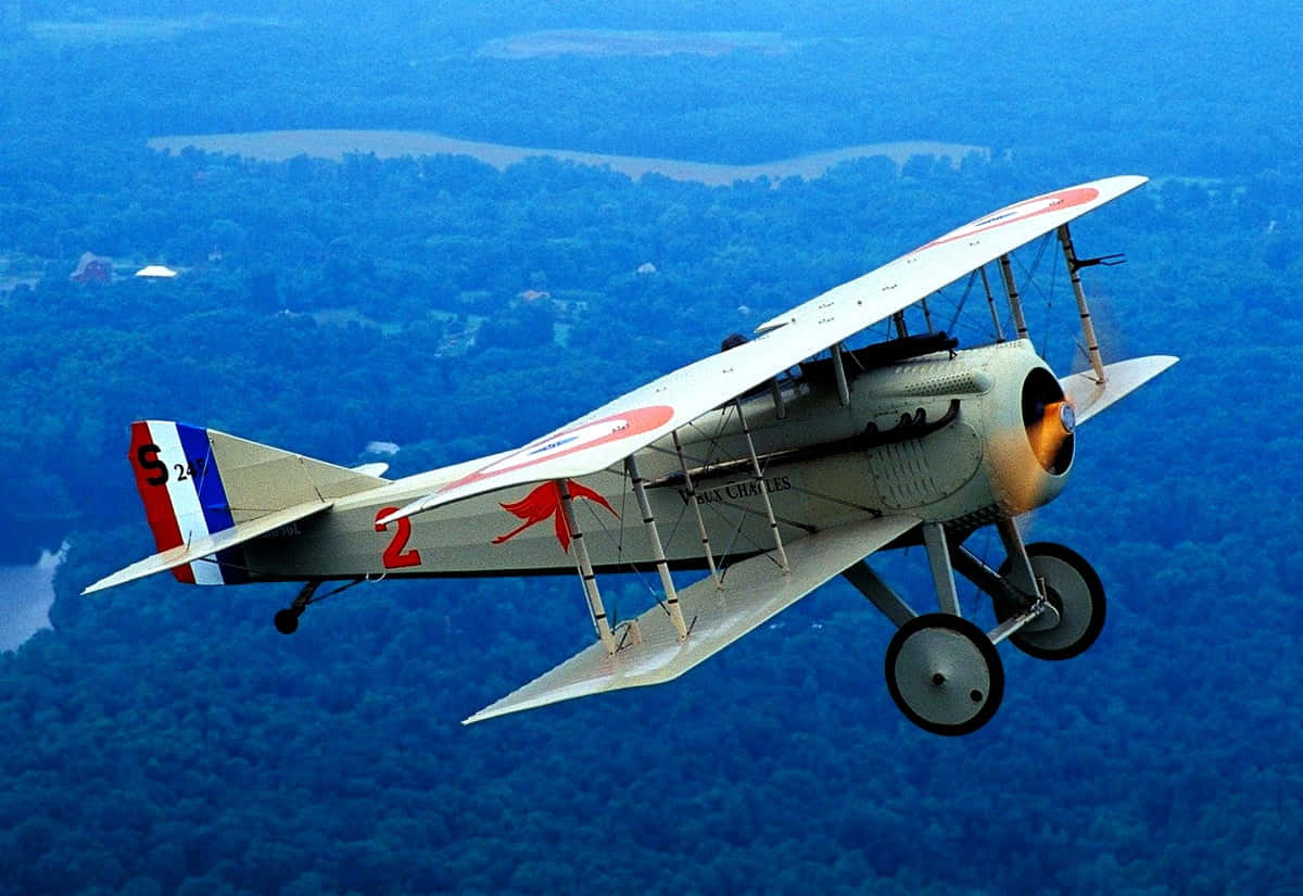 Spad Xiii Small Airplane Flies Over Thick Forest Background