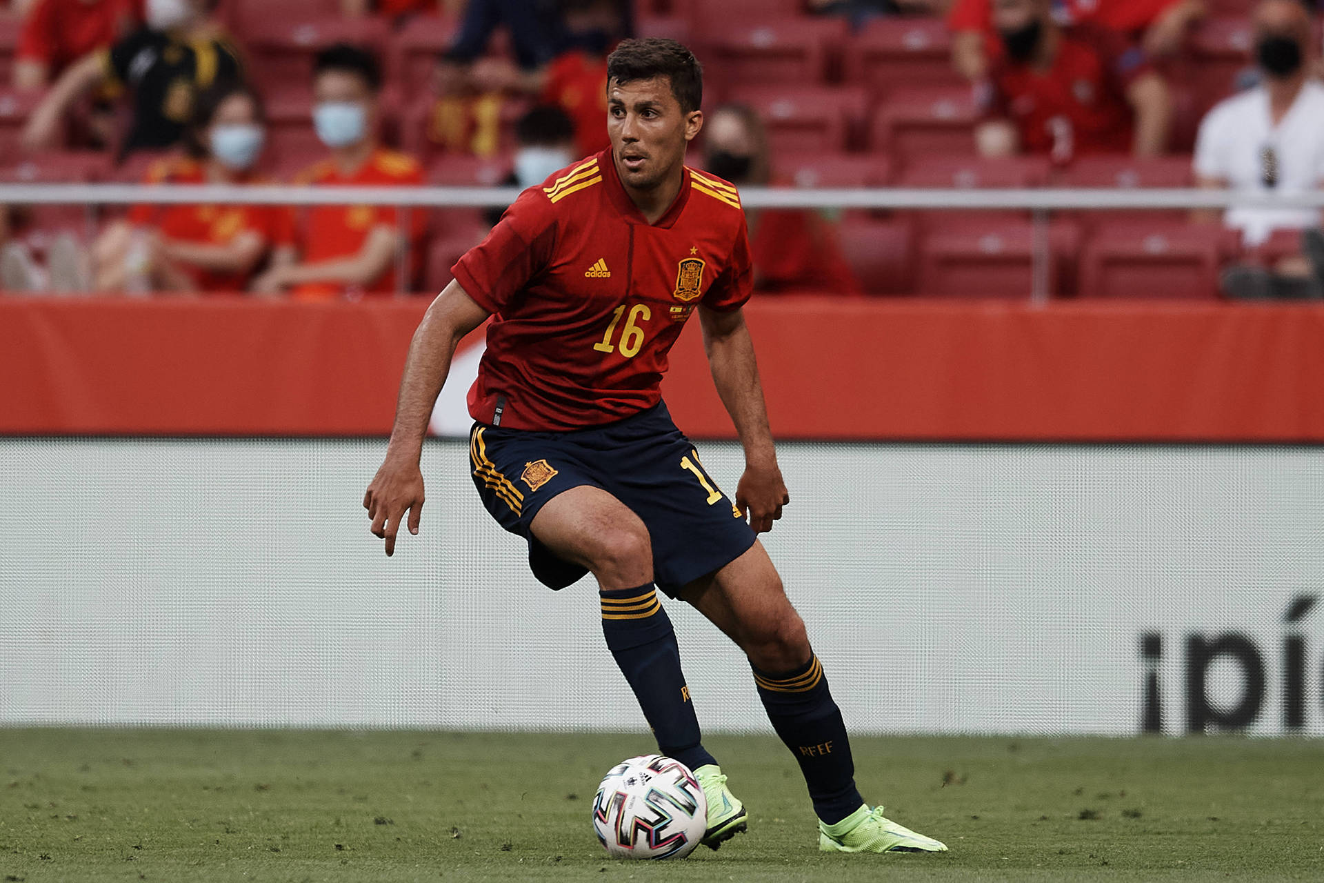 Spanish Footballer Rodri In Soccer Field Background