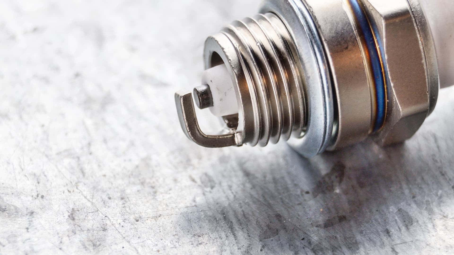 Spark Plug Placed On Surface Background