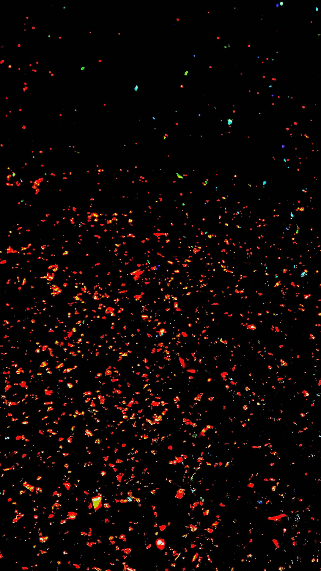 Sparkly Red Pieces In The Dark Sky Background