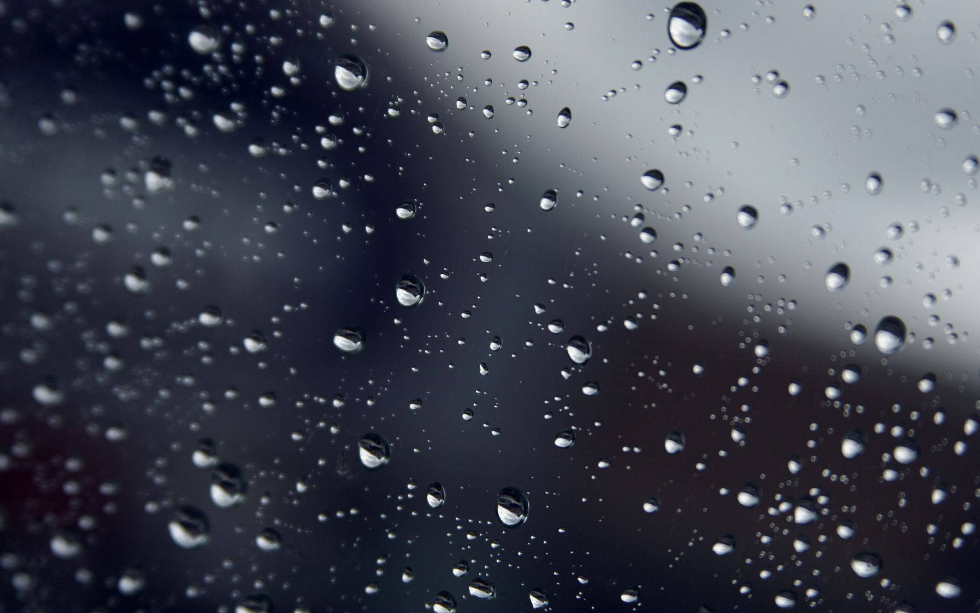 Sparse Raindrops On A Smooth Glass Surface Background