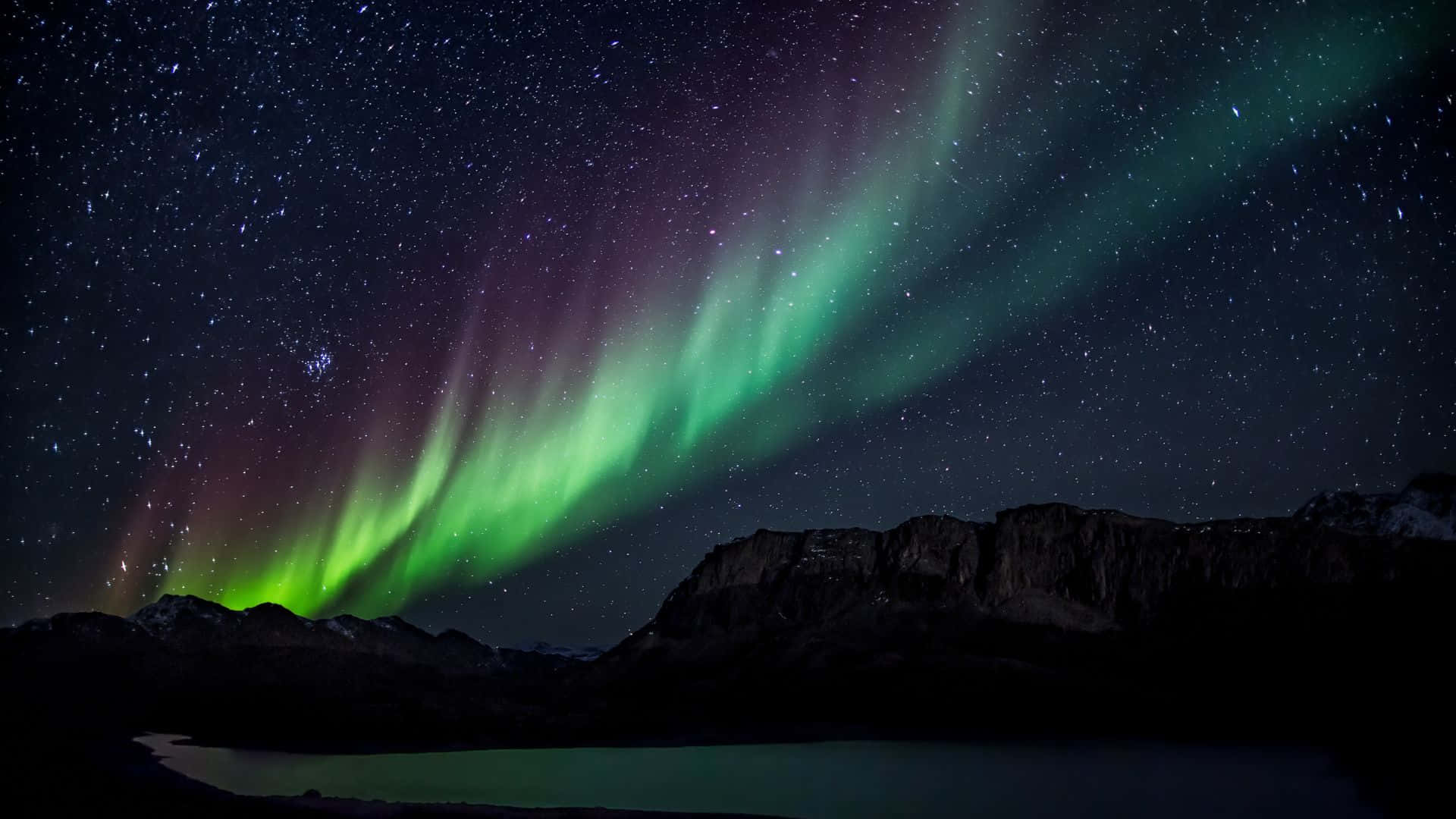 Spectacular Aurora Borealis Illuminating The Night Sky Background