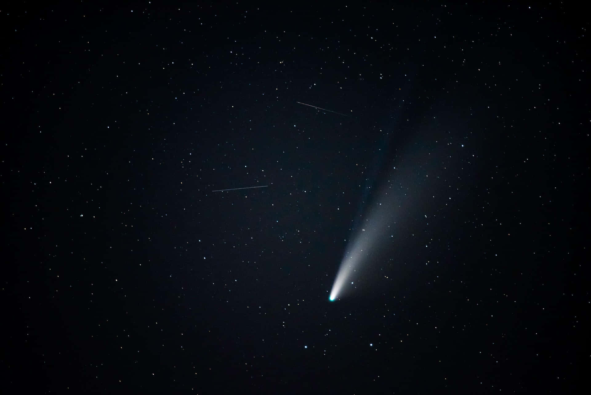 Spectacular Comet Lighting Up The Night Sky Background