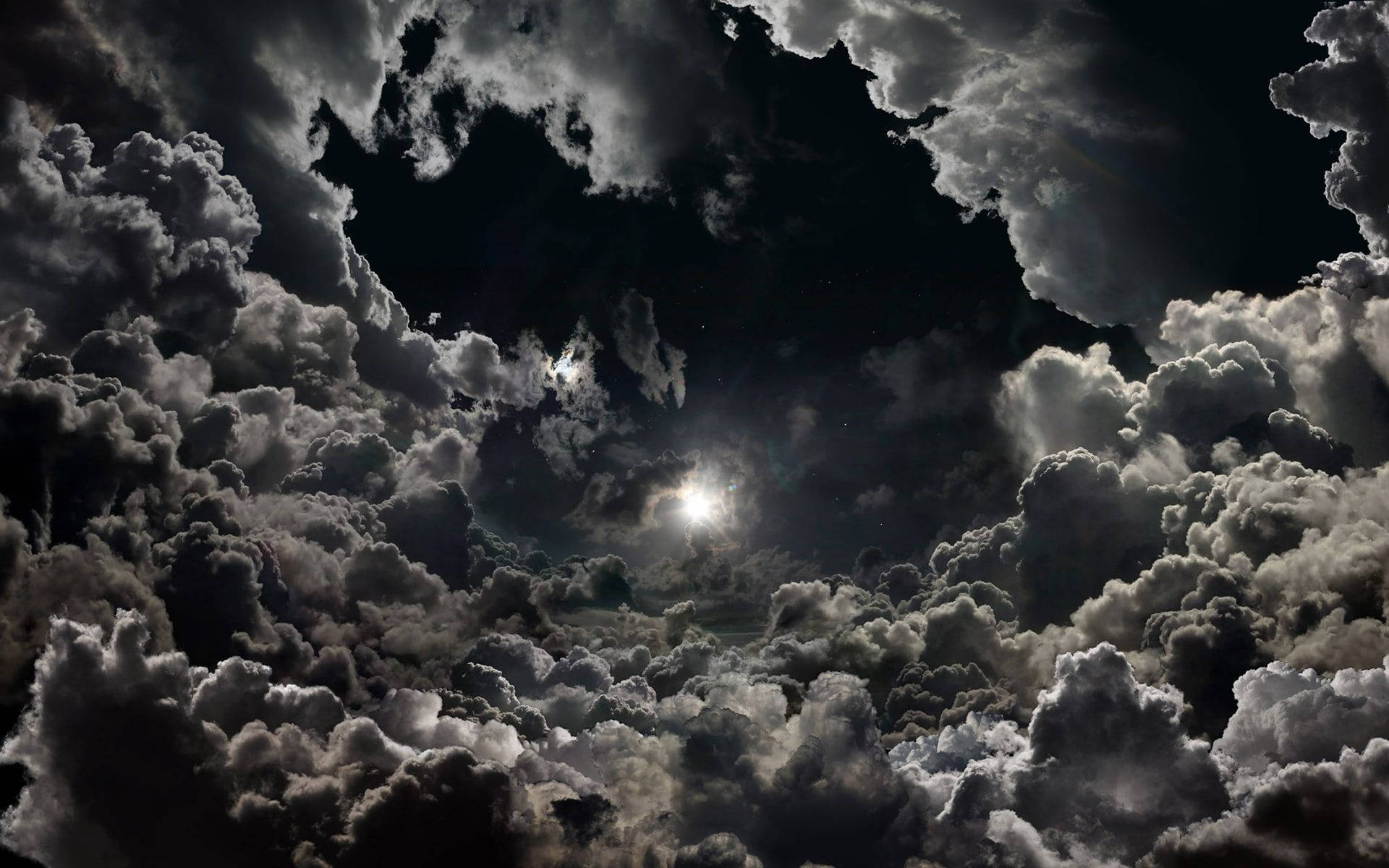 Spectacular Display Of Glowing Moon Within High-resolution Clouds Background