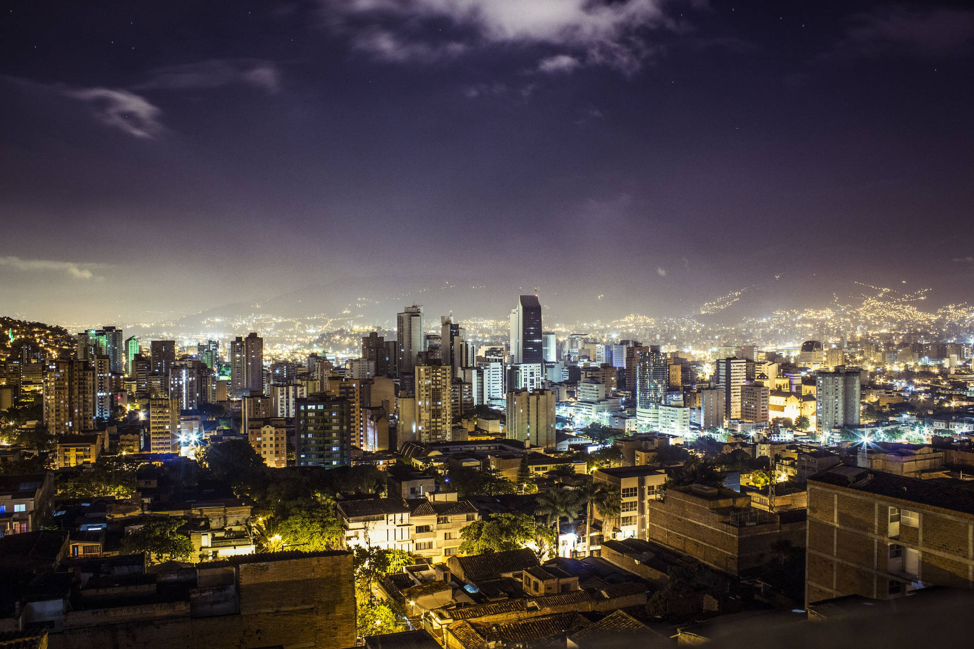 Spectacular Night View Of Vibrant Medellin City Background