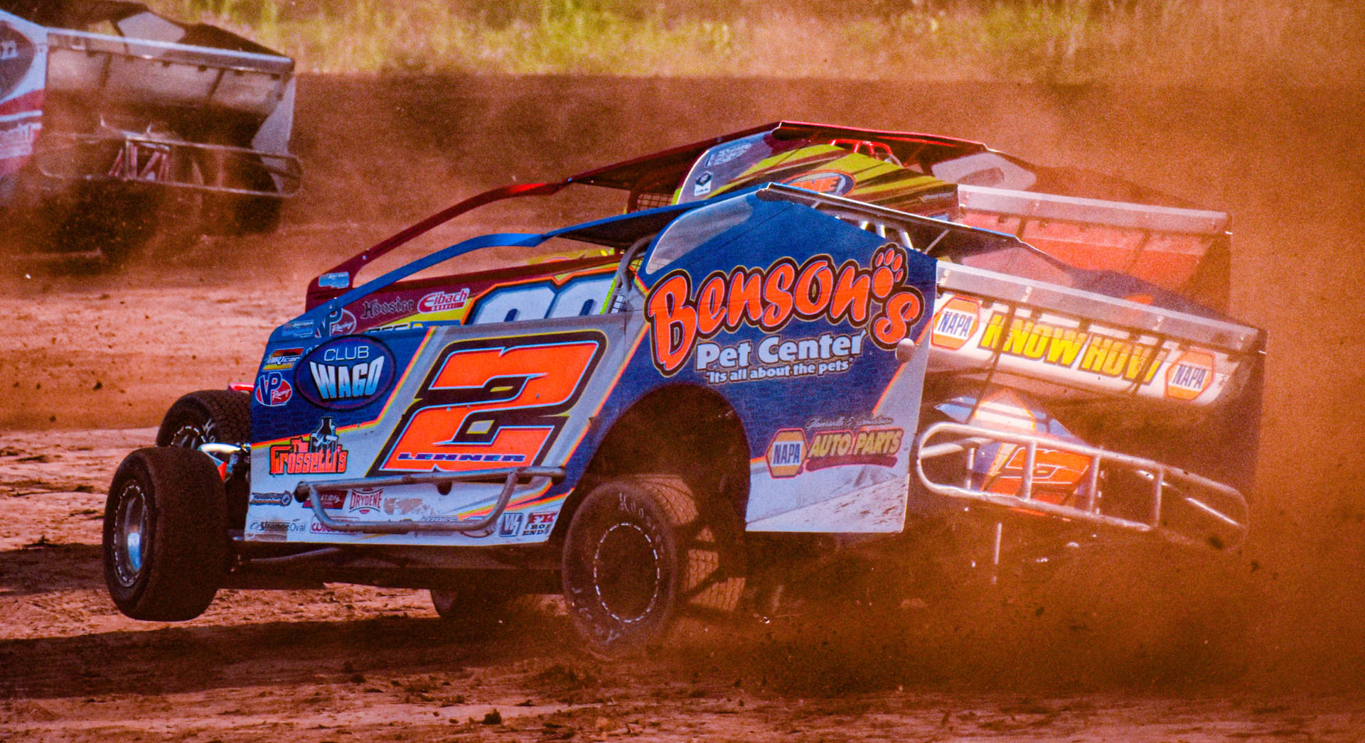 Speed And Thrills Await On The Dirt Track Background