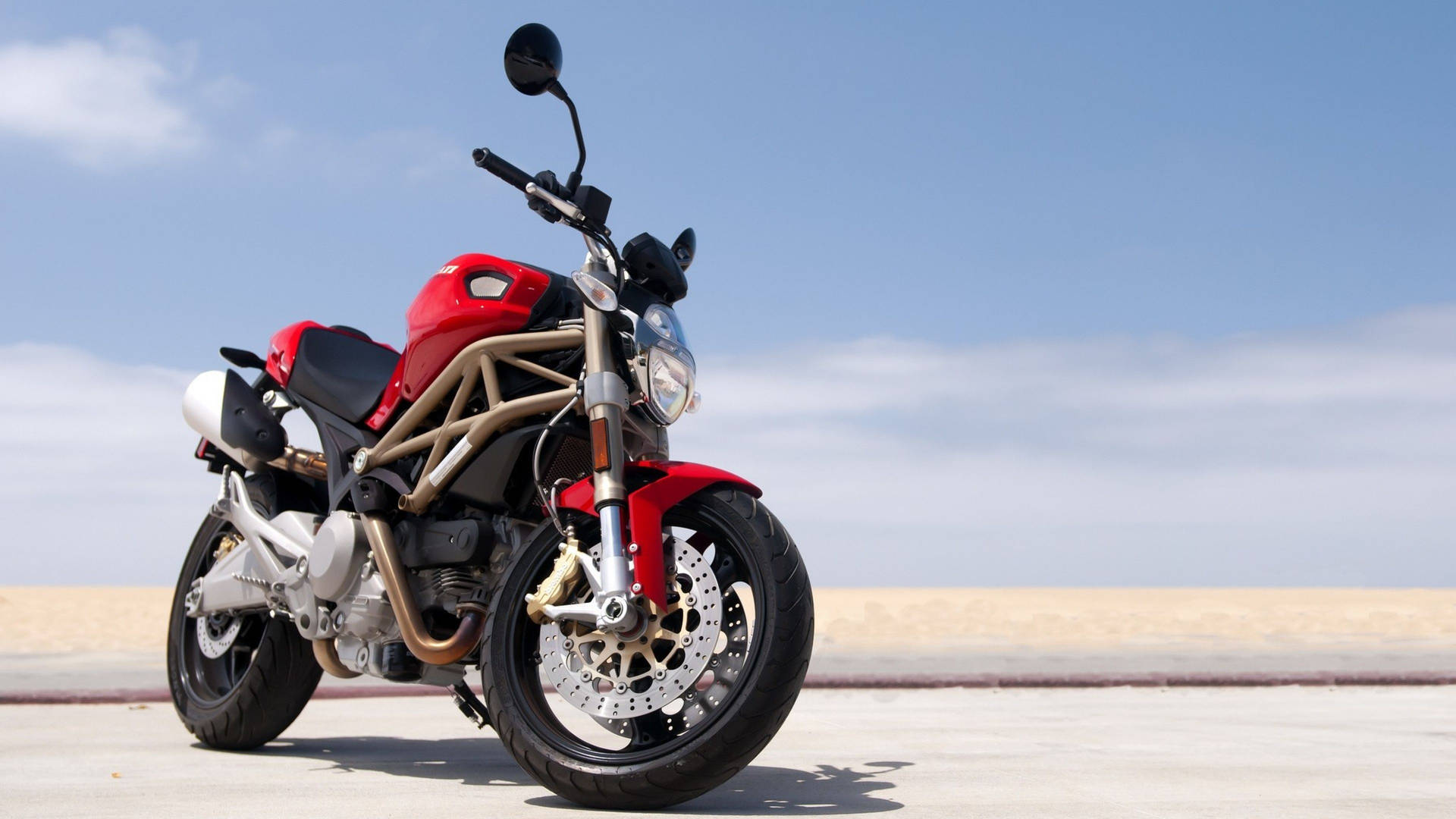 Speed Meets Style On The Red Ducati Diavel Motorbike Background