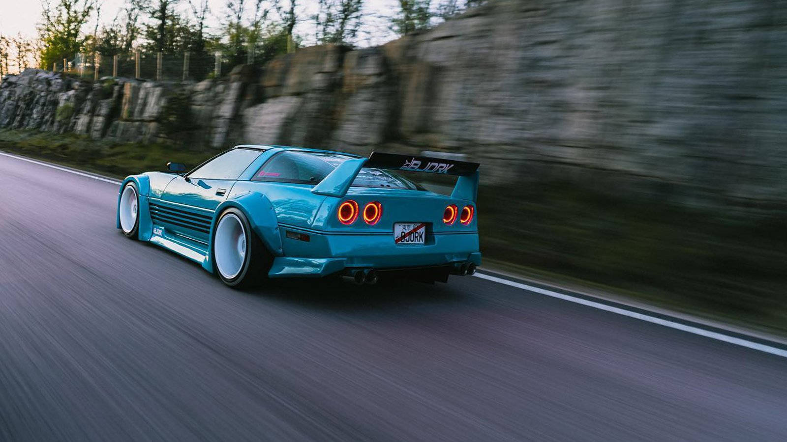 Speeding Blue C4 Corvette Background