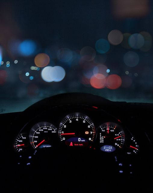 Speedtest Display On A Car Dashboard At Night Background