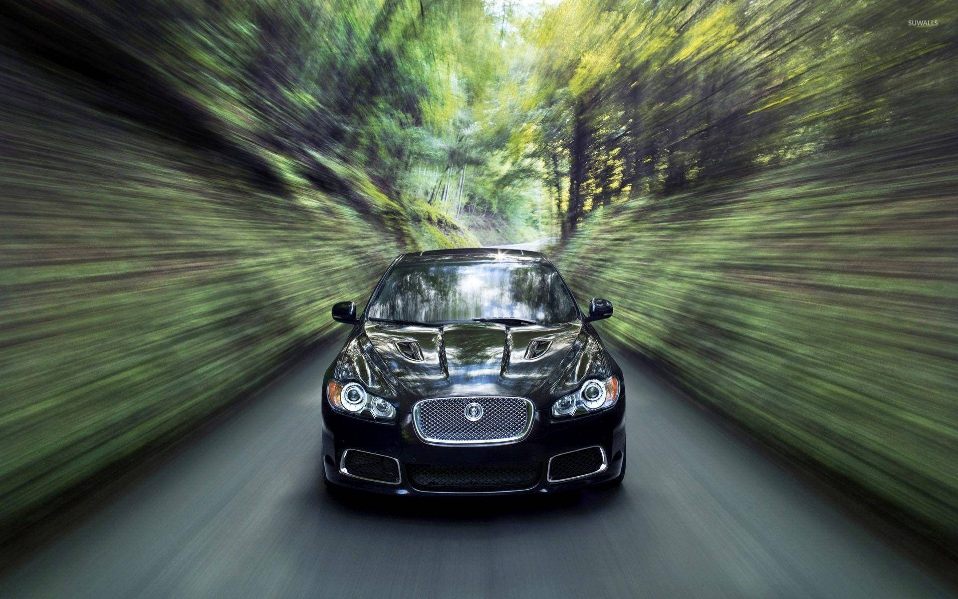 Speedy Black Jaguar Car Background