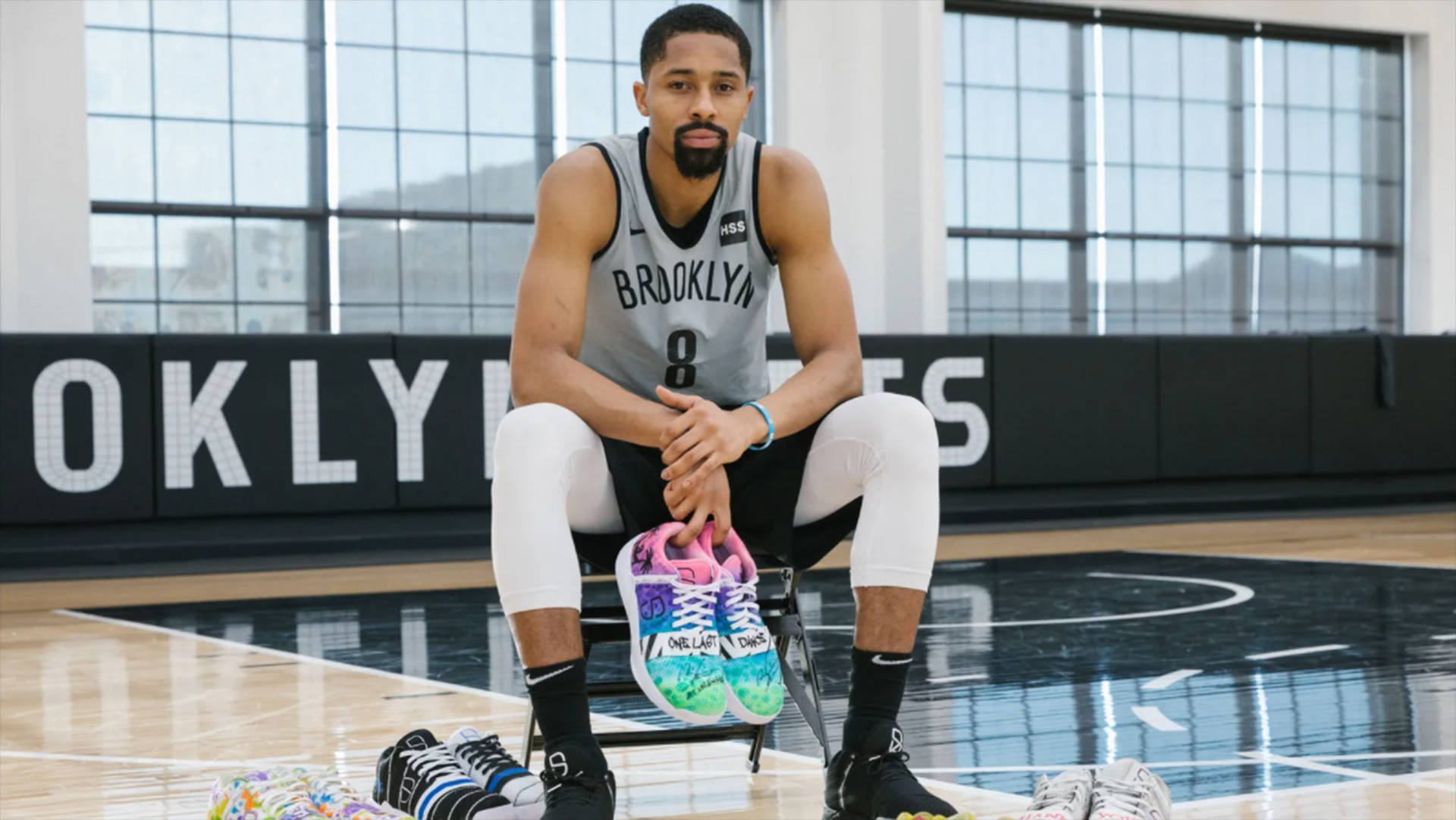 Spencer Dinwiddie With Colorful Sneakers Background