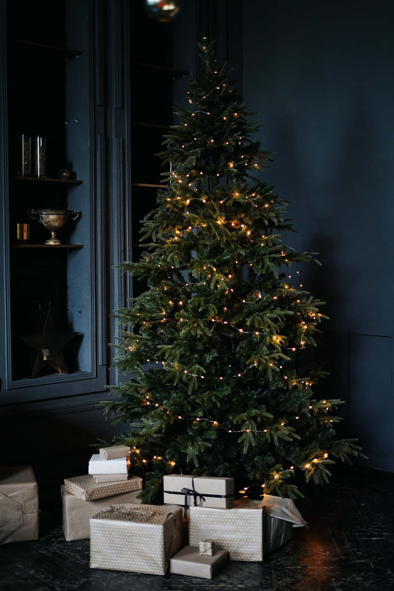 Spend A Magical Christmas Evening In The Warmth Of The Christmas Lights. Background