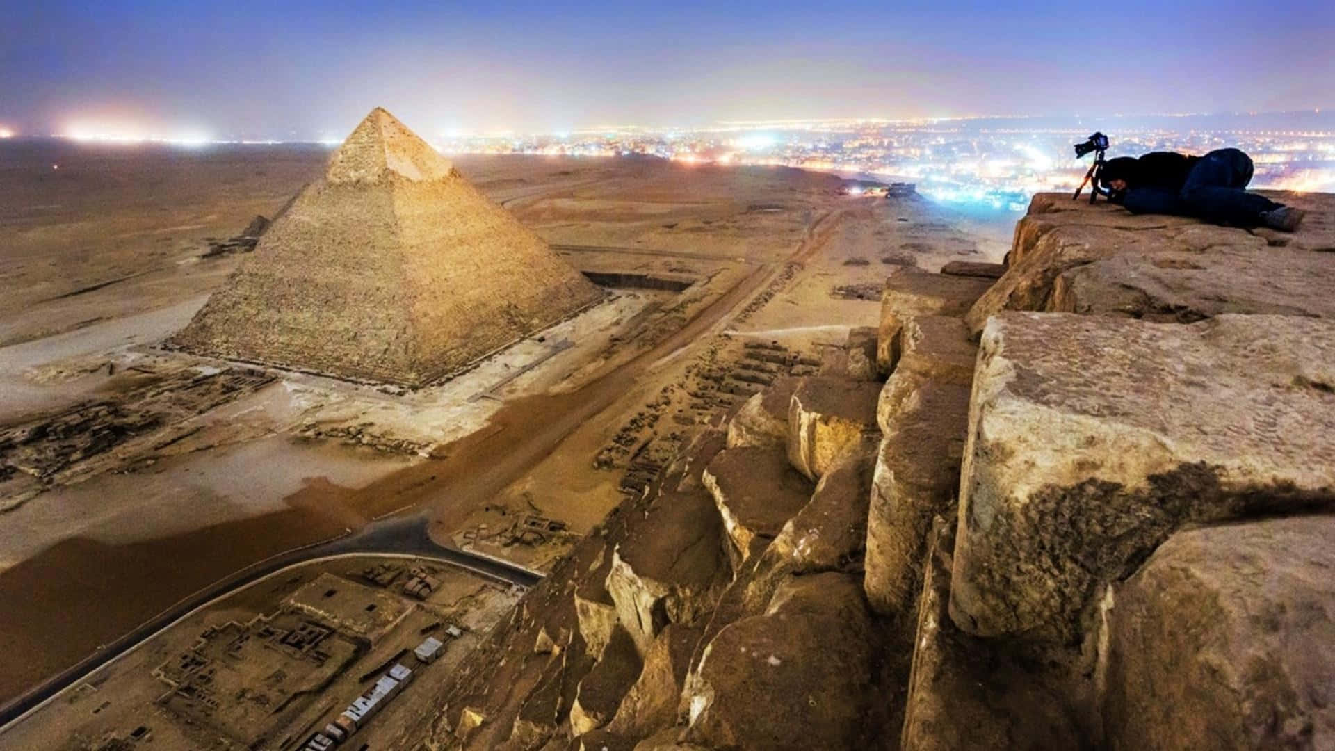 Sphinx Of Giza Illuminated At Night Background