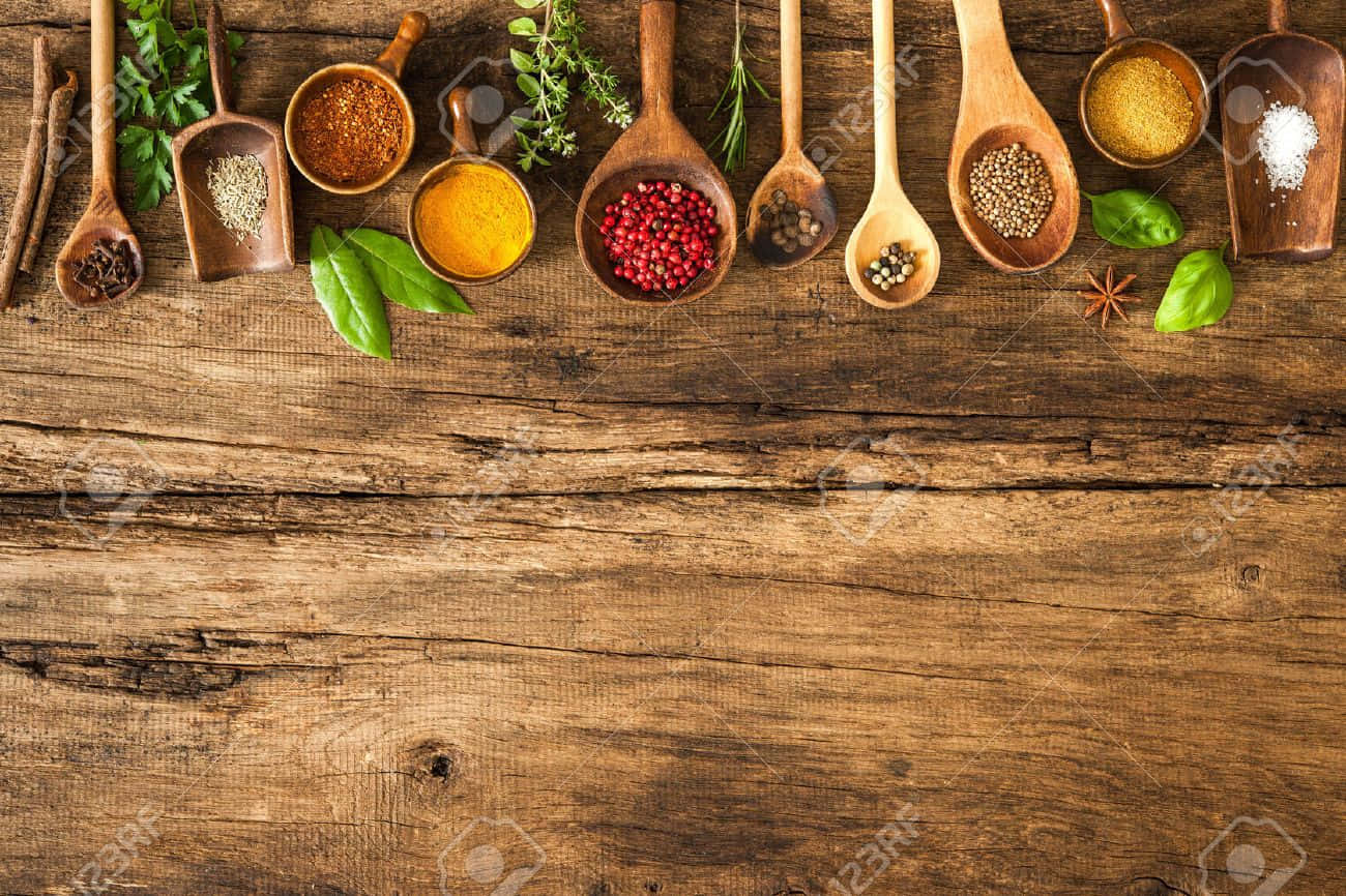 Spices And Herbs In Wooden Spoons On Wooden Background Stock Photo - Etsy Background