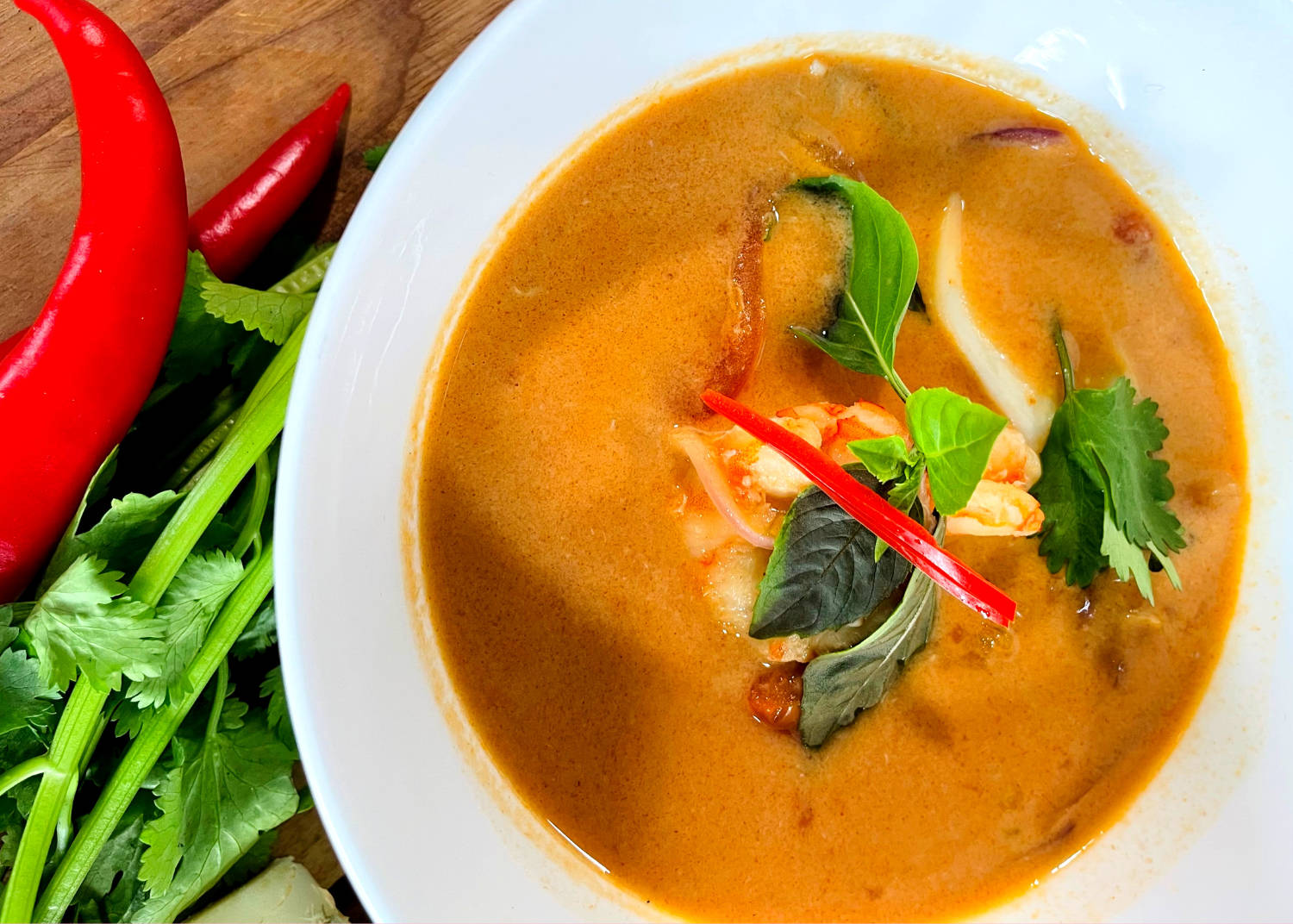 Spicy Tom Yum Soup Infused With Traditional Herbs Background