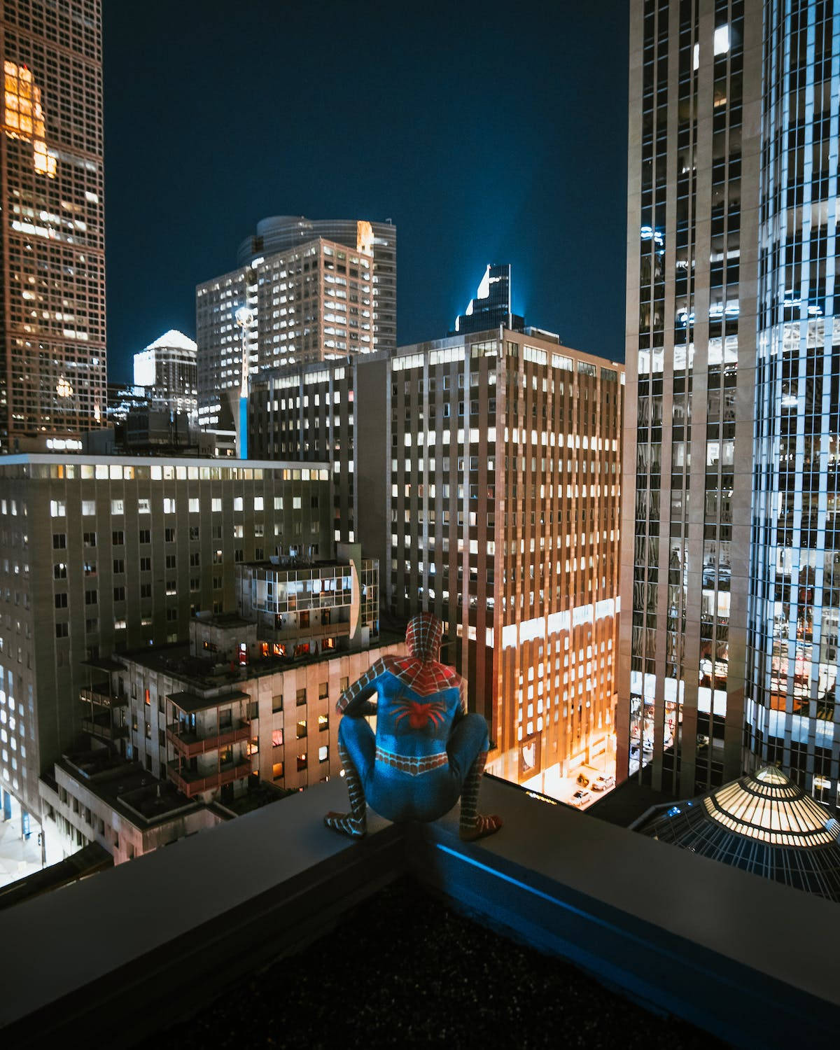 Spider Man Squatting Night City Background