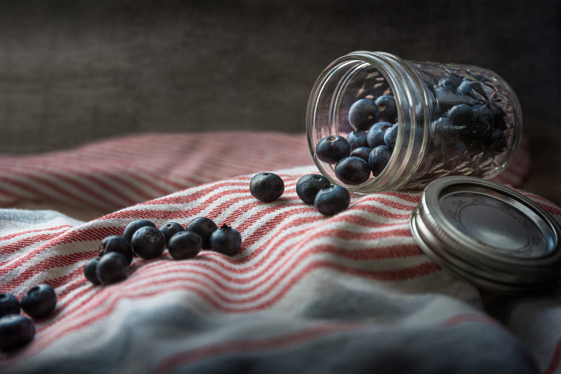Spilled Jar Of Blueberries Background