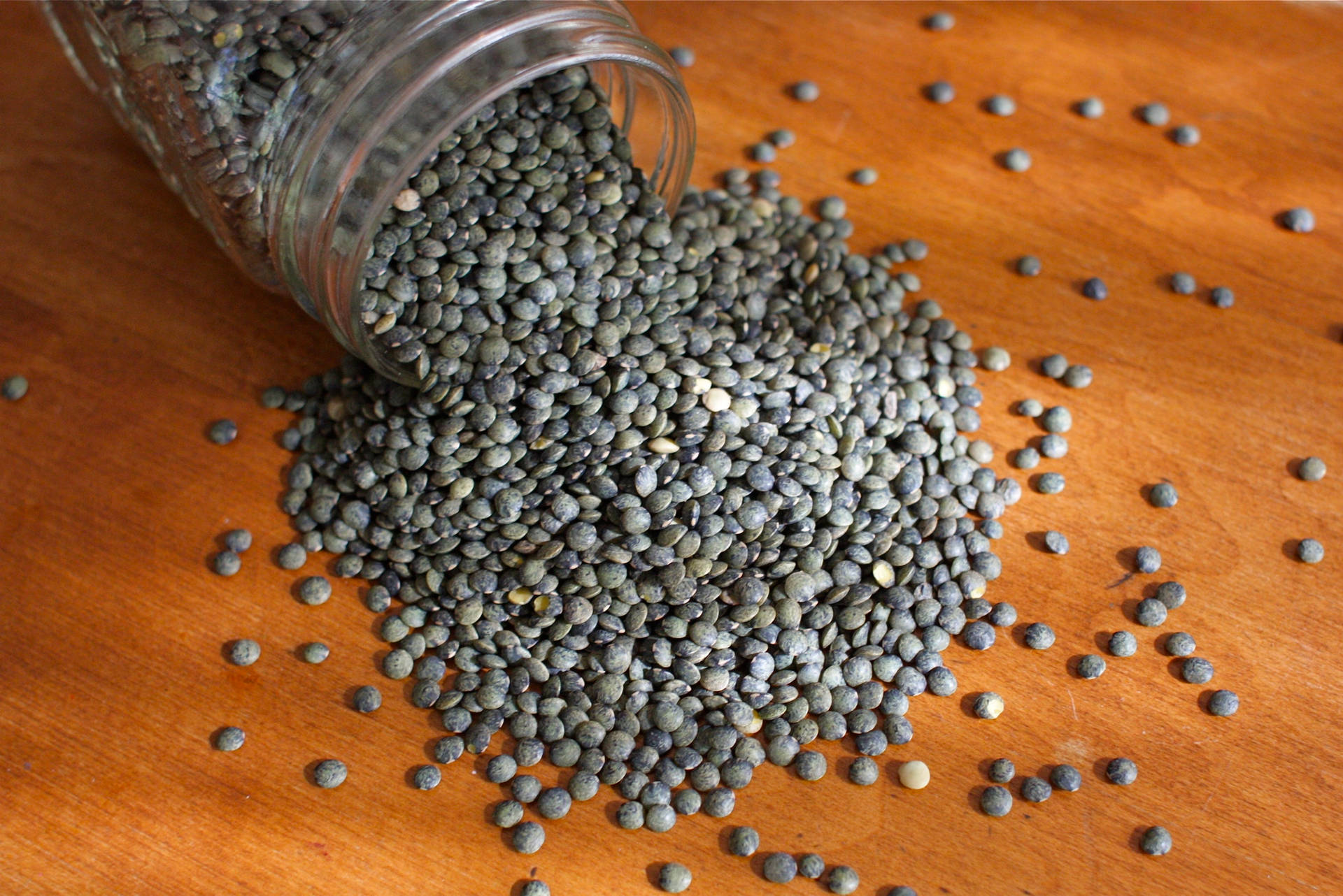 Spilled Lentils From Jar Background