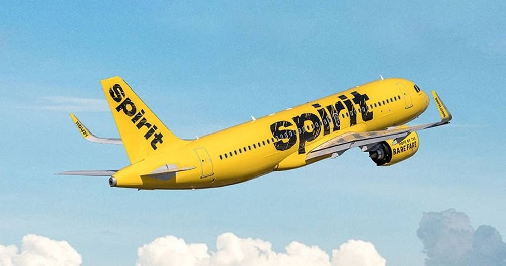 Spirit Airlines Bright Yellow Aircraft On Runway Background