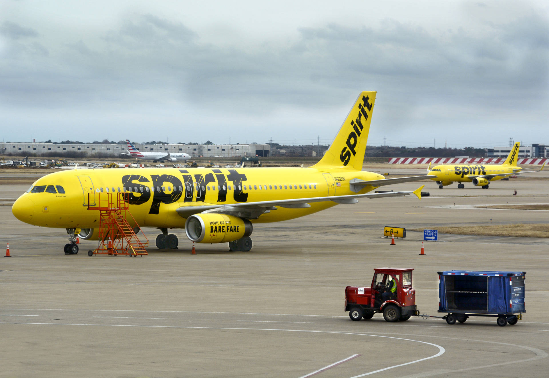 Spirit Airlines Plane And Airport Tractor