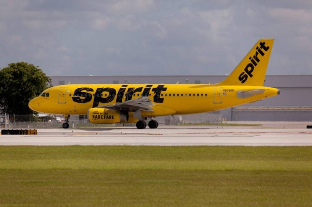 Spirit Airlines Plane On Green Grass Background